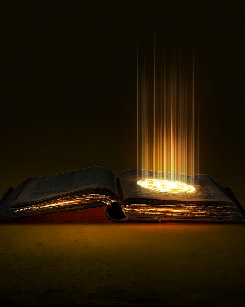 An arcane book shining with mystical light representing the books, horror novels, novellas and short stories of author, John F Leonard.