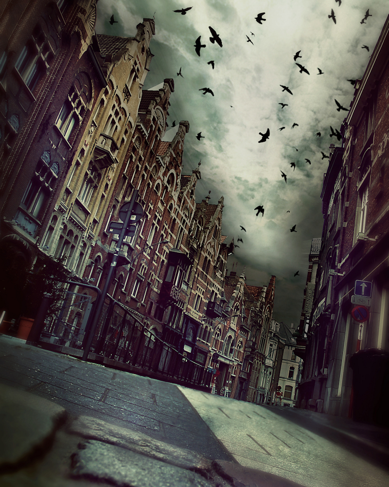 A spooky town street and crows that represents the Bledbrooke cosmic horror stories concept by John F Leonard.